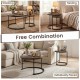 Modern round rustic brown coffee table showcasing a vintage design, ideal for versatile placement in living room or.