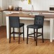 Set of 2 PVC leather bar stools with solid wood legs, featuring comfortable upholstery and a durable rubber wood frame.