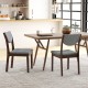 Set of 2 wood kitchen chairs with gray faux leather seats, featuring ergonomic backrests for comfort in a dining area.
