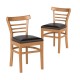 Curved backrest and sturdy rubber wood legs of a brown dining chair, perfect for cafes and bistros, ensuring comfort.