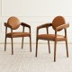 Set of 2 brown wooden dining chairs with PU leather upholstery and curved backrests, perfect for dining areas.