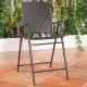 Folding rattan bar chair with armrests and footrest, featuring a sturdy steel frame for outdoor and indoor use.