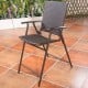Folding rattan bar chair with a lightweight steel frame and comfortable armrests, perfect for indoor and outdoor.