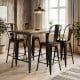 Black metal bar stools with backrests and footrests, stackable design for kitchen island or home bar use.