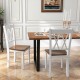 Two wooden farmhouse kitchen chairs with rubber wood seats, featuring a cross backrest, in an elegant dining setting.