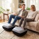 Shiatsu foot massager in black with air compression and heat, providing customized relaxation for couples on a sofa.