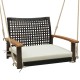 Single rattan porch swing with acacia wood armrests and white cushion, ideal for outdoor relaxation on the patio.