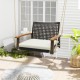 Single rattan porch swing with white cushion, acacia wood armrests, and durable hanging ropes for outdoor relaxation.