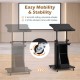 Height adjustable black sit-to-stand laptop desk cart with storage and 4 locking wheels for stability in any workspace.