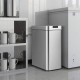 Slim stainless steel 13.2 Gal kitchen trash can with wing lids, designed for narrow spaces and featuring a soft-closing.
