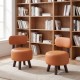 Round orange ottoman footrest stools with backrest, featuring rubber wood legs and ergonomic design, perfect for living.
