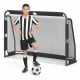 Youth soccer player posing with a 6 ft x 4 ft metal frame soccer goal set, ideal for backyard training and recreation.