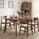 Set of 4 walnut dining chairs with curved backrests, featuring breathable linen upholstery for comfort and durability.