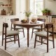 Round dining table with four walnut solid rubber wood chairs featuring curved backrests, perfect for a stylish kitchen.