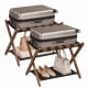 Folding luggage rack with solid rubberwood frame and nylon shelf, providing a comfortable height for easy packing and.
