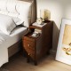 Brown solid wood end table featuring a spacious top, pull-out tray, and two drawers for stylish bedside storage.