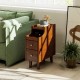 Narrow solid wood end table in brown with pull-out tray and two drawers, perfect for bedside storage and organization.