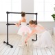 Freestanding black ballet barre for dancing and stretching, adjustable height, sturdy construction, ideal for home or.
