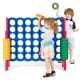 Children playing with the Jumbo 4-to-Score Giant Game Set, featuring colorful rings for outdoor fun and skill.