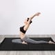 Black 4' x 10' thick folding gymnastics mat for yoga and tumbling, featuring a portable design and durable PU leather.