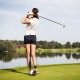 Women's golfer swinging a club on the course, showcasing the lightweight 9-piece golf club set for beginners.
