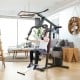 Multifunction Cross Trainer Workout Machine with dual arm press and pulley system, ideal for home fitness exercises.