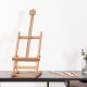 Adjustable portable wood tabletop easel in smooth beech wood, perfect for artist painting display and easy transport.