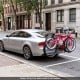 Trunk mount 3-bike rack in pink, designed for SUVs, featuring anti-sway straps and soft padding for stability.