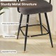 Close-up of the swivel bar stool's sturdy metal frame with adjustable foot pads, featuring a grey boucle cover.