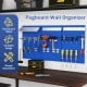 Navy wall-mounted pegboard kit with 3 metal boards and 28 accessories for versatile tool organization in garages.