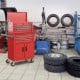 6-drawer red rolling tool storage chest cabinet with universal wheels, featuring a sturdy metal frame for garage.