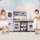Interactive dark brown corner toy kitchen set with light and sounds, featuring realistic appliances and removable sink.