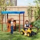 Kids Gas Station Playhouse in brown with gas refueling guns, featuring a waterproof canopy and storage shelves for.