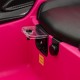 Close-up of the control panel on the pink 12V Lamborghini kids ride-on car with integrated AUX and USB ports.