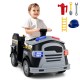 Toddler riding a black 12V fire toy car with steering wheel, lights, and accessories for imaginative play.