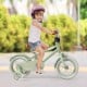 Kids bike with adjustable handlebar and saddle in green, featuring training wheels for safe learning and balance.