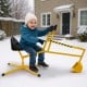 Yellow sand digger for kids with 360-degree swivel, adjustable arms, and flexible shovel, perfect for all-season.