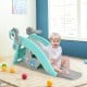 Toddler enjoying the 4-in-1 blue slide and rocking horse playset, featuring a basketball hoop and detachable seat.