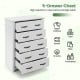 Tall storage dresser in white with 5 pull-out drawers, ideal for clothes, books, and toys in any room.