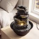 Tabletop water fountain with LED light, showcasing a serene multi-tier design and tranquil water sounds for indoor.