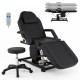 Tattoo chair with adjustable backrest and footrest, black faux leather, includes hydraulic stool for esthetician use.