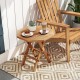 Teak wood octagon coffee table with slatted tabletop and X-shaped legs, perfect for outdoor use and easy storage.