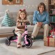 Toddler tricycle in pink with adjustable seat and rear storage basket, perfect for kids aged 3-5 years indoors or.