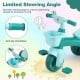 Toddler tricycle in green with limited steering angle, anti-slip handlebars, and front basket for toy storage.