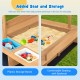 Kids wooden sandbox with striped canopy featuring comfortable seating and plastic storage boxes for toys and sand.
