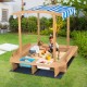 Kids wooden sandbox with striped canopy, featuring solid cedar wood, seating, and storage bins for outdoor play.