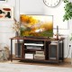 Rustic brown TV stand with open storage shelves, accommodating TVs up to 50 inches, featuring power outlets and cable.