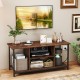 Rustic brown TV stand featuring two open compartments and a built-in charging station, perfect for organizing media.