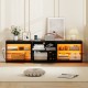 Black TV stand with RGB LED lighting, open shelves, and built-in power outlets for TVs up to 85 inches.