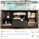 Black TV stand with glass doors, featuring adjustable shelves, a drawer, and ample storage for TVs up to 70 inches.